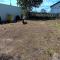 Photo of cleared land behind shed