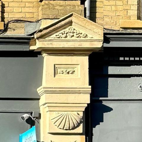 Delicately carved triangular pediments