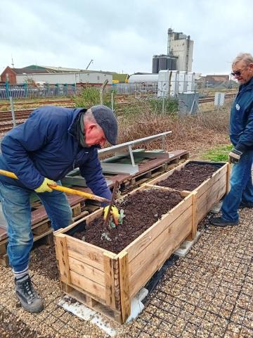 Photo of Filling the planter with soil